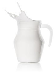 Splash of milk in a glass transparent decanter