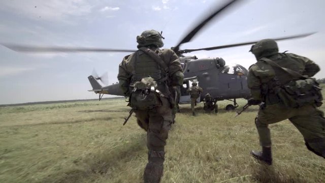 Russian special forces soldiers evacuate by helicopter MI-35m (Hind).