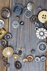 vintage buttons on old wooden boards
