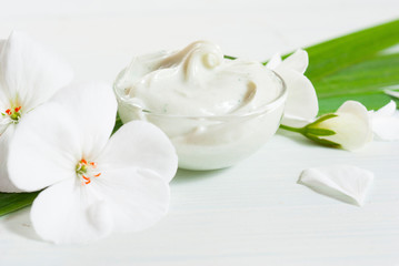 Fototapeta na wymiar Cosmetic cream white flower