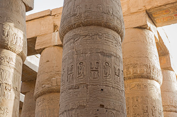 Ancient egyptian hieroglyphic carvings on columns in temple