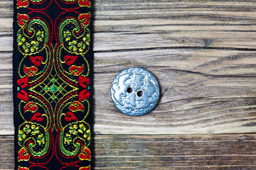 vintage band with embroidered ornaments and old button