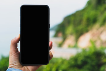 Woman hand using smartphone.