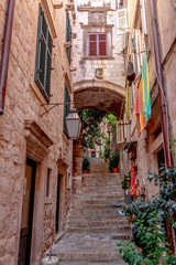 Fototapeta na wymiar Dubrovnik cobble streets, stairs into the city, Croatia