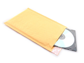 Envelope with CD in case over white background