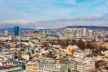 Obraz premium The city of Zurich in Switzerland as seen from the tower of the Grossmunster cathedral in winter. Zurich is the largest city in Switzerland and the capital of the Swiss canton of Zurich.