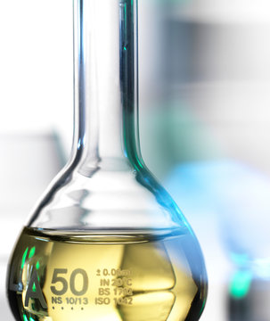 Laboratory beaker containing chemical formula
