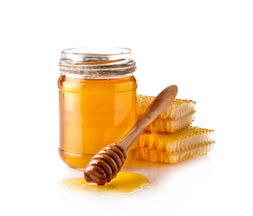 Luquid honey and Honeycomb with wooden spoon