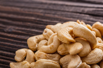cashew nuts on a rustic wooden background