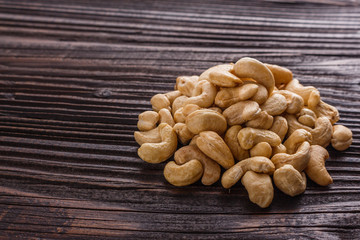 cashew nuts on a rustic wooden background