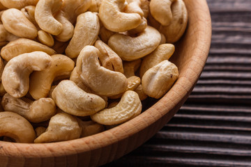cashew nuts on a rustic wooden background