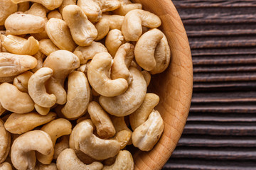 cashew nuts on a rustic wooden background