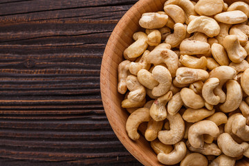 cashew nuts on a rustic wooden background