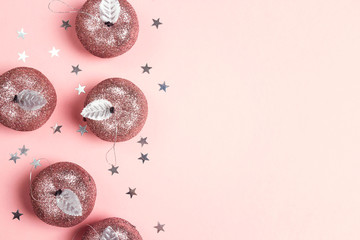 Border of decorative apples and stars with copy space on pink background.