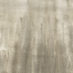 Yellow watercolor texture with abstract washes and brush strokes on the white paper background.