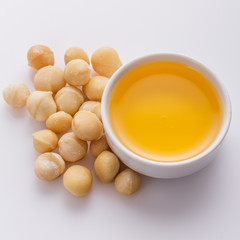 delicious macadamia nuts on a white acrylic background
