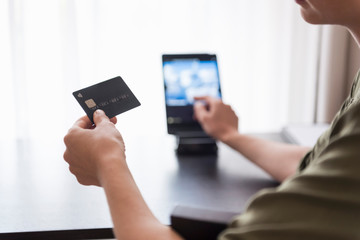 Close-up of hand holding credit card