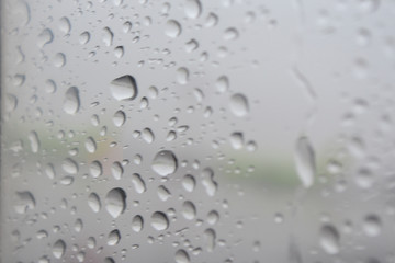 Rain, water droplets on the glass.