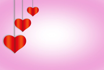 Three red hearts on laces against background of a pink gradient background