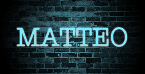 Fototapeta premium first name Matteo in blue neon on brick wall