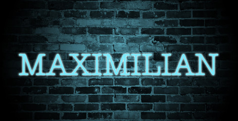 first name Maximilian in blue neon on brick wall