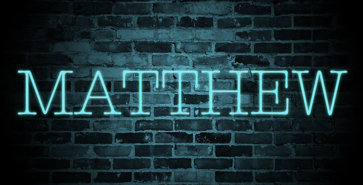 first name Matthew in blue neon on brick wall