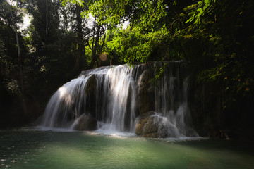 Fototapeta na wymiar Deep forest Waterfall in Kanchanaburi, Thailand