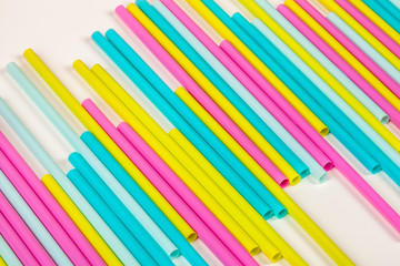 Colorful straws for beverage soft drink on colored background