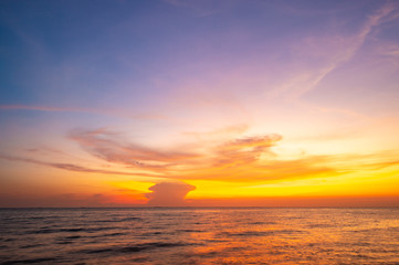 Naklejka na ściany i meble Evening sunset over the sea.