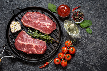 marbled beef top blade steak with herbs, vegetables and spices black Angus