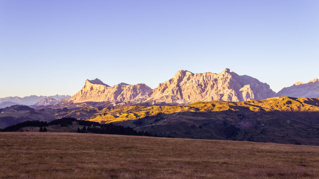 Mountains of Fanes Group at sunset: Sas dles Diesc (Cima Dieci), Sas dla Crusc (Monte Cavallo), Lavarella and Piz dles Cunturines (Cima Cunturines) viewed from Cherz, Alta Badia, Dolomites, Italy