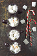 Hot drink with marshmallows on a loft style background. Christmas loft composition