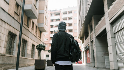 Rear view of man walking on street