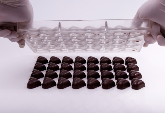 making chocolate hearts - Powered by Adobe