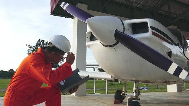 Asian male engineers were checking the availability of aircraft footage 4K