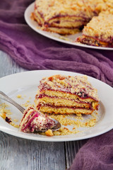 cake with blueberry jam on wooden background