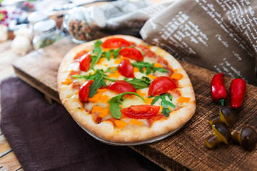 pizza with mozzarella, emmental and cheddar cheese