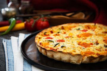 VEGETABLE PIE WITH CHERRY TOMATOES, GRILLED PEPPERS AND COURGETTES With fresh eggs and fresh cream