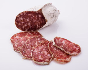 Saucisson sec delicious french salami on a white background