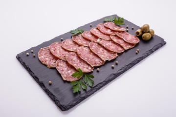 Saucisson sec delicious french salami on a white background