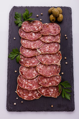 Saucisson sec delicious french salami on a white background
