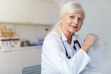 Senior female doctor smiling at the camera