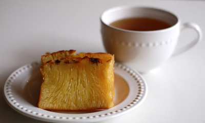 Bika Ambon and a cup of drink. Indonesian honeycomb cake. Popular cake from Medan, North Sumatra, Indonesia. 