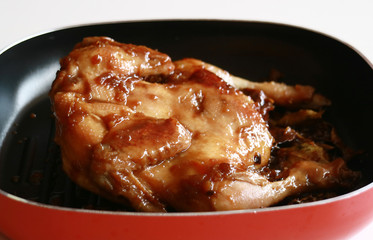 Ayam ungkep. Chicken is cooked in spices prior to deep frying. Can be grilled too. Popular dish in Indonesia.