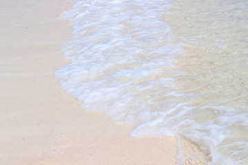 Beach sand and ocean waves on Koh Poda. Summer vacation and the tourist relax concept.