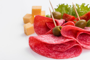 delicious sliced salami on a white background