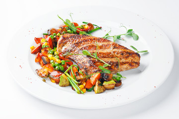 Fried piece of meat with vegetable salad. top view