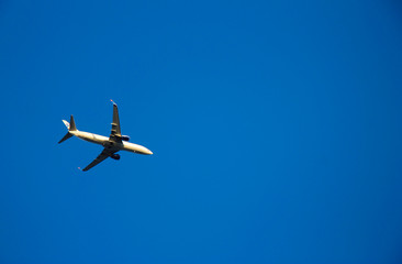 Airplane flying against blue sky