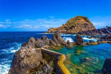 Traditional swimming pools on the island coast of Madeira, in Porto Moniz region, Spain - obrazy, fototapety, plakaty