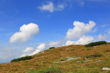 clouds over hill